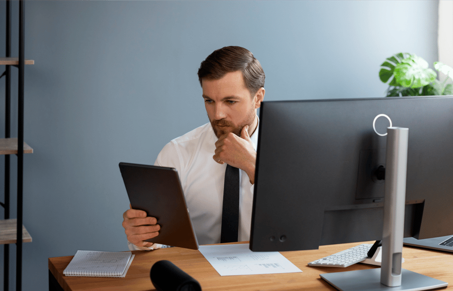 business_person_looking_finance_graphs_1
