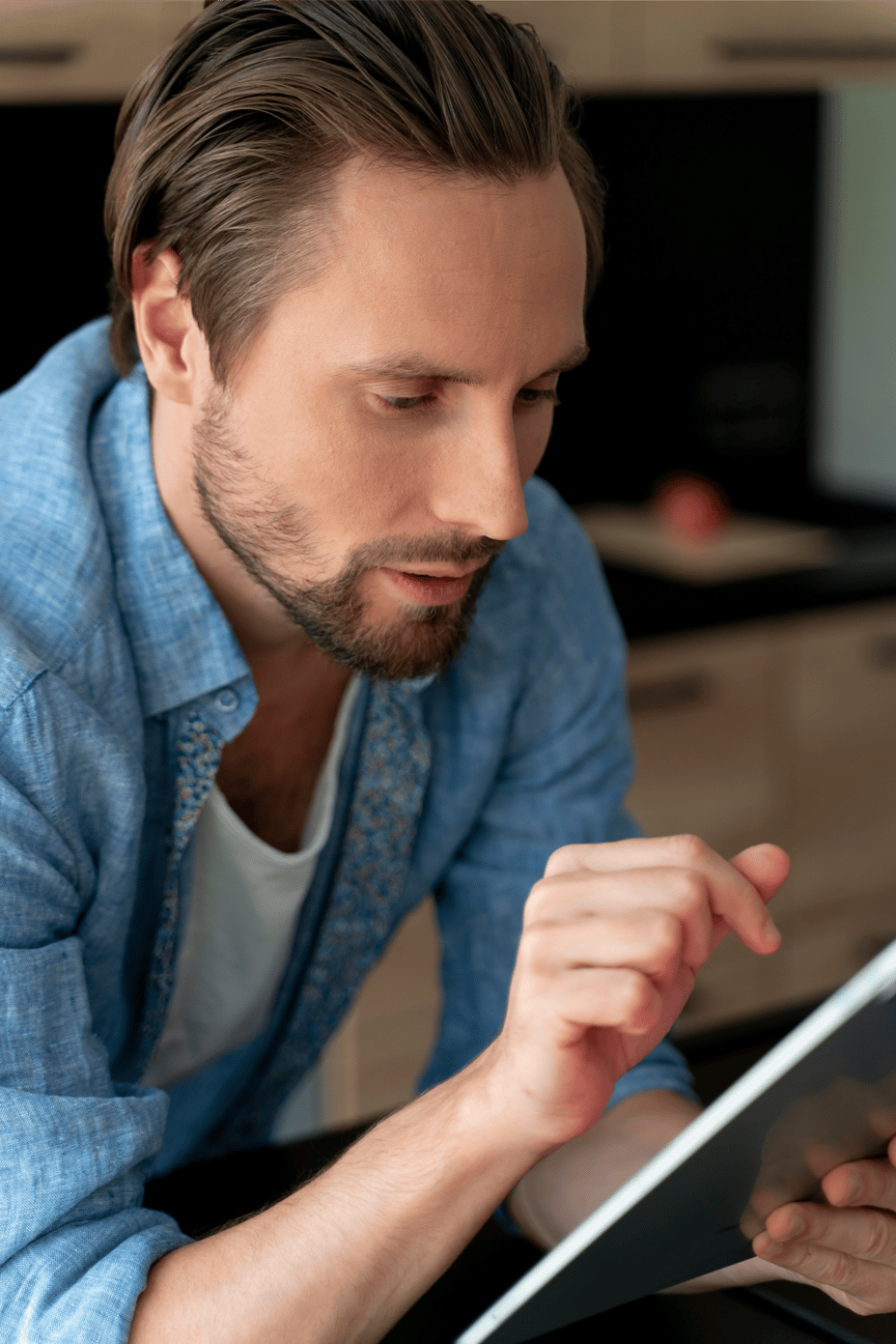 close_up_man_using_digital_device_home_1