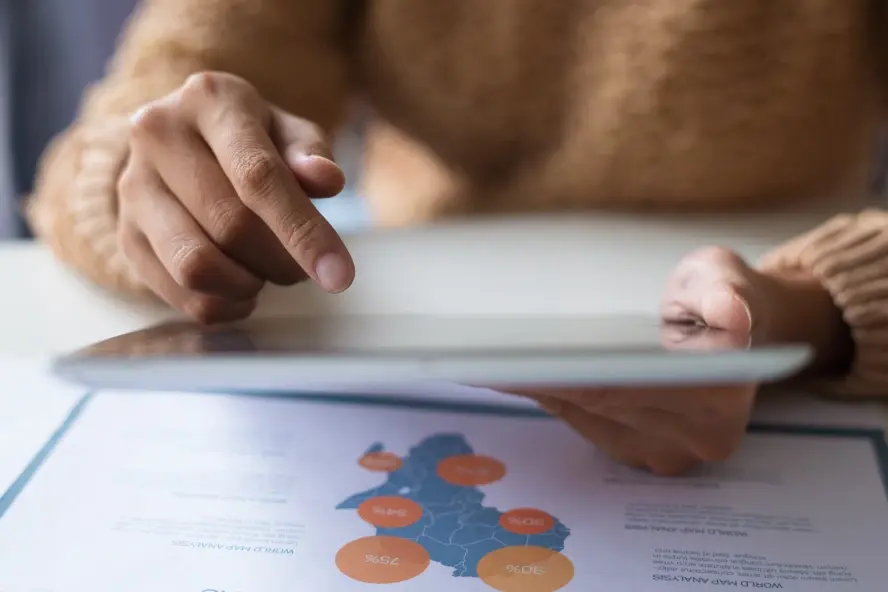 close_up_lady_using_tablet_while_examining_data_1